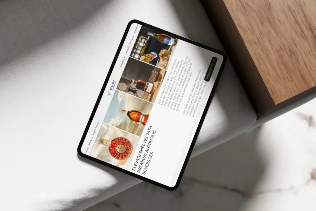Mockup of a beverage e-commerce product page displayed on a tablet resting on a modern couch